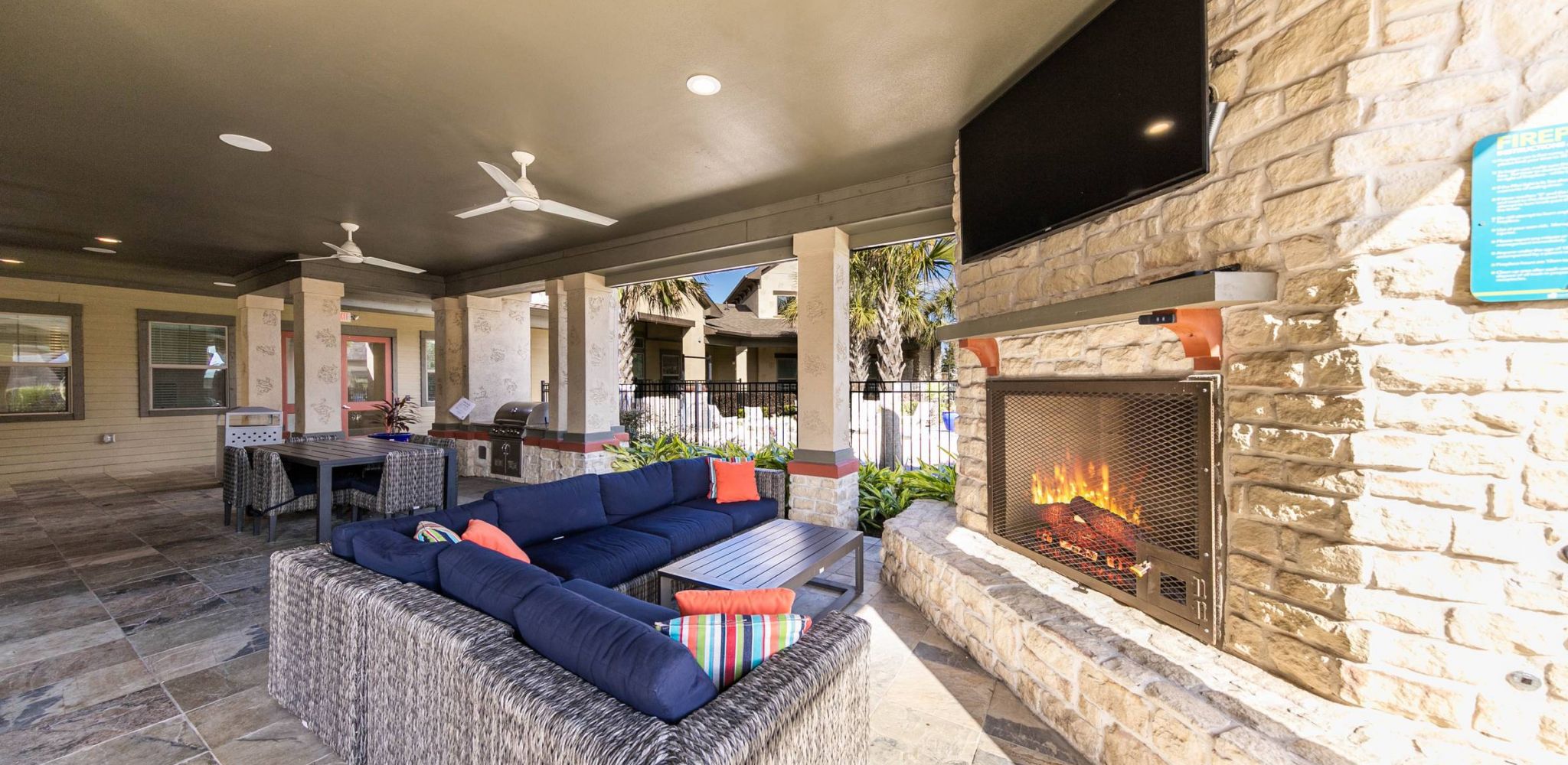 Hawthorne at Crenshaw outdoor covered patio with seating and fireplace
